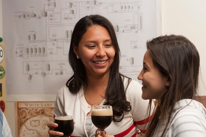 Eilyn Polanco from Columbia and Fernanda Marques from Brazil talk and have a beer between classes at UC Davis..
